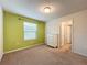 Bedroom with green accent wall and carpet at 8829 Corcovado Dr, Kissimmee, FL 34747
