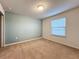 Spacious bedroom with neutral wall colors and carpeted floor at 8829 Corcovado Dr, Kissimmee, FL 34747