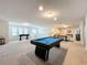 Spacious game room with a pool table and foosball at 8829 Corcovado Dr, Kissimmee, FL 34747