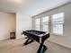 Game room with foosball table and large windows at 8829 Corcovado Dr, Kissimmee, FL 34747