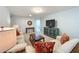 Bright bonus room, great for entertainment, features a TV and comfortable seating at 8829 Corcovado Dr, Kissimmee, FL 34747