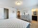 Bright bedroom with king bed, dresser, and en-suite bathroom access at 8829 Corcovado Dr, Kissimmee, FL 34747