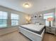 Large bedroom with king-size bed, ample natural light, and calming decor at 8829 Corcovado Dr, Kissimmee, FL 34747