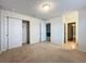 Bright bedroom with carpet floors and access to hallway and bathroom at 8829 Corcovado Dr, Kissimmee, FL 34747