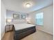 King bed, nightstands, and calming decor at 8829 Corcovado Dr, Kissimmee, FL 34747
