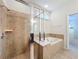Large walk-in shower with tile surround and built in shelving at 8829 Corcovado Dr, Kissimmee, FL 34747
