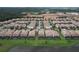 Aerial view of a community with houses and pools at 8829 Corcovado Dr, Kissimmee, FL 34747