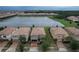 Aerial view of houses near a lake at 8829 Corcovado Dr, Kissimmee, FL 34747