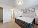 Bedroom with king bed and access to a bathroom at 8829 Corcovado Dr, Kissimmee, FL 34747