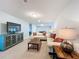 Bonus room with seating area, TV, and access to game room at 8829 Corcovado Dr, Kissimmee, FL 34747