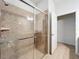 Modern bathroom with a large tiled shower and glass enclosure at 8829 Corcovado Dr, Kissimmee, FL 34747