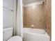 Bathroom with tub shower and toilet at 8829 Corcovado Dr, Kissimmee, FL 34747