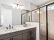 Modern bathroom with double vanity and glass shower at 2122 Whitney Marsh Aly, Orlando, FL 32804