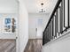 Bright entryway with modern staircase and hardwood floors at 2122 Whitney Marsh Aly, Orlando, FL 32804
