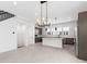 Modern kitchen with island, stainless steel appliances and dark cabinetry at 2122 Whitney Marsh Aly, Orlando, FL 32804