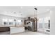 Modern kitchen features stainless steel appliances and an island at 2122 Whitney Marsh Aly, Orlando, FL 32804