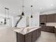 Modern kitchen with island, stainless steel appliances and dark cabinetry at 2122 Whitney Marsh Aly, Orlando, FL 32804