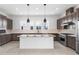 Modern kitchen with island, stainless steel appliances and dark cabinetry at 2122 Whitney Marsh Aly, Orlando, FL 32804