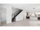 Open living space with kitchen, staircase, and powder room at 2122 Whitney Marsh Aly, Orlando, FL 32804