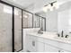 Modern bathroom with double vanity, hexagon tile shower, and black accents at 2138 Whitney Marsh Aly, Orlando, FL 32804