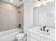 Clean bathroom with a tub, toilet, and vanity with quartz countertop at 2138 Whitney Marsh Aly, Orlando, FL 32804