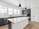 Modern kitchen with gray cabinets and island at 2138 Whitney Marsh Aly, Orlando, FL 32804