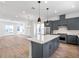 Modern kitchen with gray cabinets and island at 2138 Whitney Marsh Aly, Orlando, FL 32804