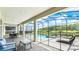 Covered patio with comfortable seating overlooking the pool and spa at 2965 Protagonist St, Kissimmee, FL 34746
