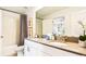 Bathroom with double vanity, bathtub, and modern fixtures at 2965 Protagonist St, Kissimmee, FL 34746