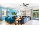 Spacious living room with sectional sofa, large TV, and pool view at 2965 Protagonist St, Kissimmee, FL 34746