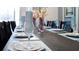 Farmhouse-style dining table set for a large party at 2965 Protagonist St, Kissimmee, FL 34746