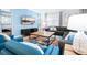 Living room with sectional sofa, accent chairs, and coffee table at 2965 Protagonist St, Kissimmee, FL 34746