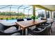Relaxing patio with dining table and chairs, overlooking the pool at 2965 Protagonist St, Kissimmee, FL 34746