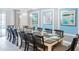 Large dining room with a long table and blue accent wall at 2965 Protagonist St, Kissimmee, FL 34746