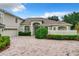 Two story home with a large driveway and landscaped yard at 1125 English Garden Se Ln, Winter Garden, FL 34787