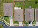 Aerial view of a single-Gathering house with a backyard and driveway at 5716 Lakeside Landings Blvd, Winter Haven, FL 33881