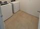 Bright laundry room complete with washer and dryer at 5716 Lakeside Landings Blvd, Winter Haven, FL 33881