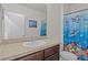 Clean bathroom with single sink and shower/tub combo at 5716 Lakeside Landings Blvd, Winter Haven, FL 33881