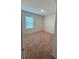 Bright bedroom featuring neutral walls and carpet at 5716 Lakeside Landings Blvd, Winter Haven, FL 33881