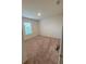 Charming bedroom with neutral carpeting and a window at 5716 Lakeside Landings Blvd, Winter Haven, FL 33881