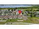 Aerial view of a house in a residential neighborhood near a lake at 5716 Lakeside Landings Blvd, Winter Haven, FL 33881