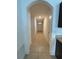 Bright hallway with tile flooring and archways at 5716 Lakeside Landings Blvd, Winter Haven, FL 33881