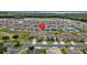 Home location shown from an aerial perspective at 5716 Lakeside Landings Blvd, Winter Haven, FL 33881