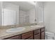 Bathroom boasts double sinks and a shower at 5716 Lakeside Landings Blvd, Winter Haven, FL 33881