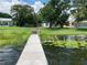 Wooden dock extending into calm lake water at 207 Robin Rd, Altamonte Springs, FL 32701