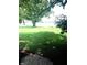 Scenic waterfront view with green grass and trees at 207 Robin Rd, Altamonte Springs, FL 32701