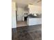 White kitchen with dark tiled floor needing updates at 207 Robin Rd, Altamonte Springs, FL 32701