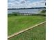 Wooden dock and grassy yard near lake at 207 Robin Rd, Altamonte Springs, FL 32701