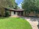 Brick house with a green lawn and driveway at 207 Robin Rd, Altamonte Springs, FL 32701