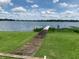 Wooden dock extending over calm lake water at 207 Robin Rd, Altamonte Springs, FL 32701